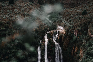 Nohkalikai waterfall in Cherrapunji surrounded by green hills and clouds