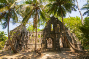 Ruins of Ross Island in Andaman surrounded by tropical greenery and sea views